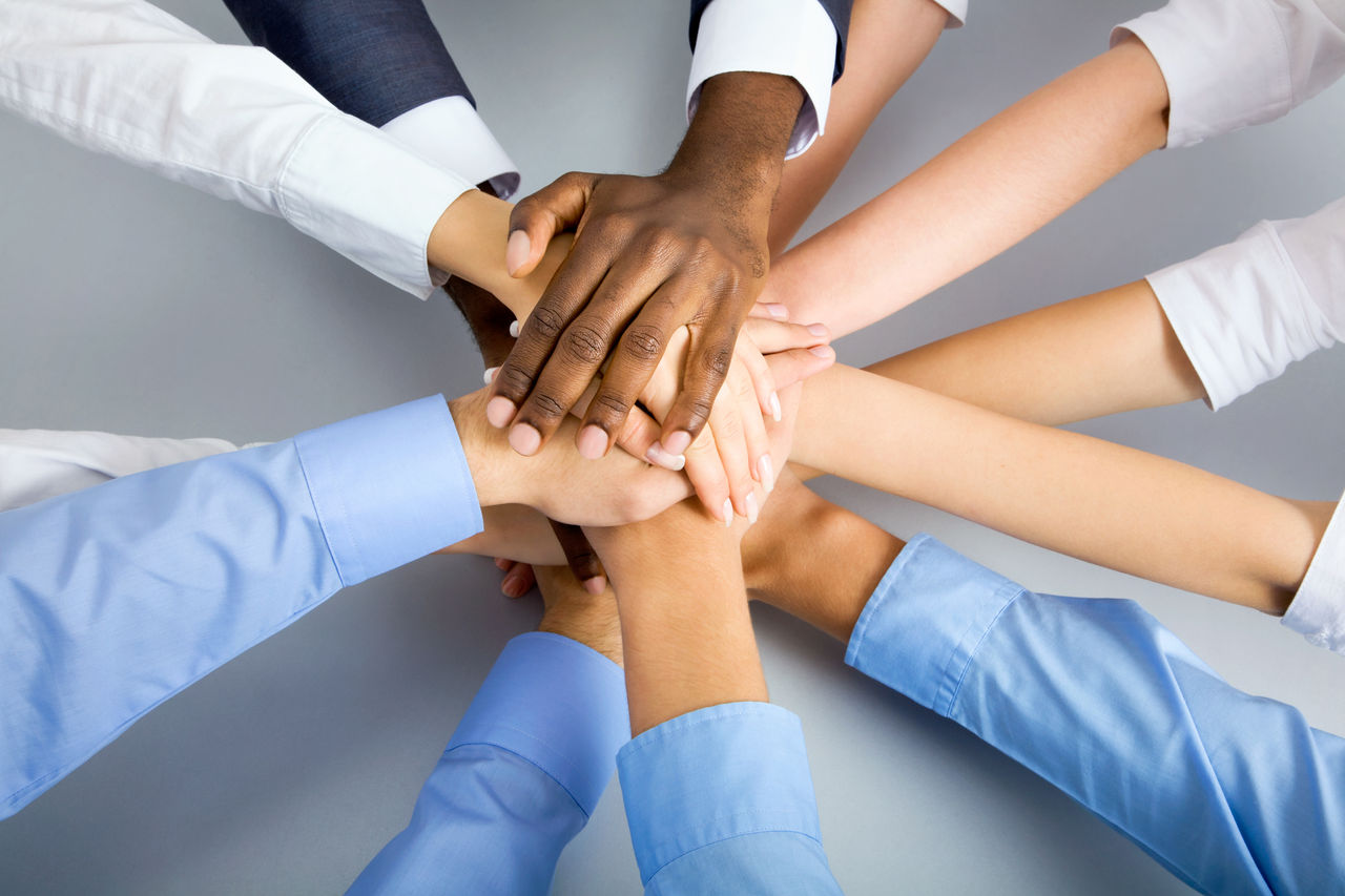 International  business team showing unity with their hands together; Shutterstock ID 114113191; PO: redownload; Job: redownload; Client: redownload; Other: redownload